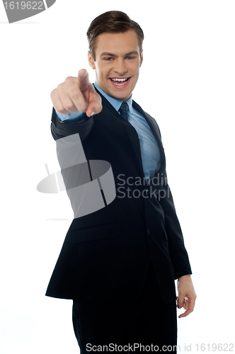 Image of Smiling young professional pointing at you