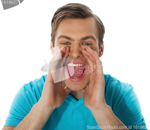 Image of Exciting young handsome man shouting