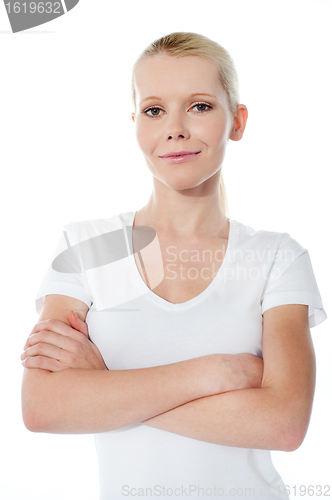 Image of Smiling teenager with folded arms