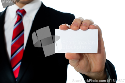 Image of Closeup shot of a man showing business card