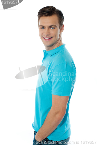 Image of Side view of smiling young man