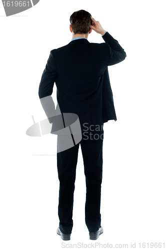 Image of Back-pose of a corporate person standing