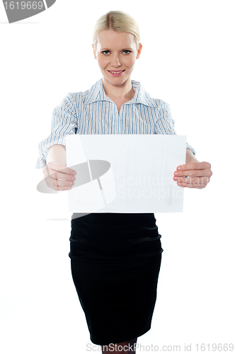 Image of Corporate woman holding a blank billboard