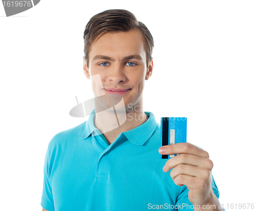 Image of Close-up of handsome guy holding a credit card