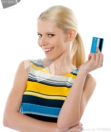 Image of Blond salesgirl posing with credit card
