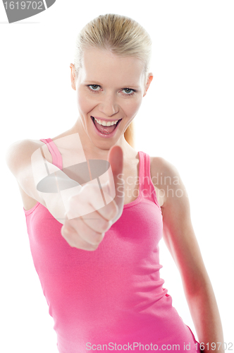 Image of Pretty attractive girl showing thumbs-up