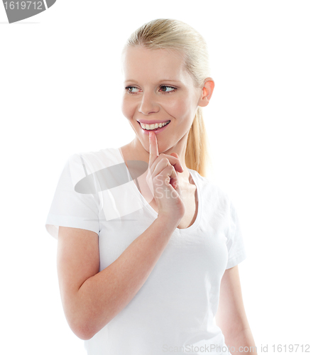 Image of Portrait of mischievious female, smiling