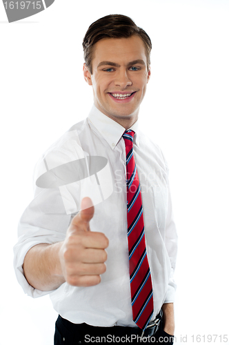 Image of Business executive with thumbs up gesture