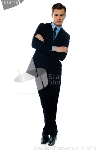 Image of Handsome business executive tilting