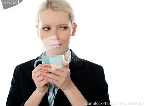 Image of Coporate woman holding coffee mug