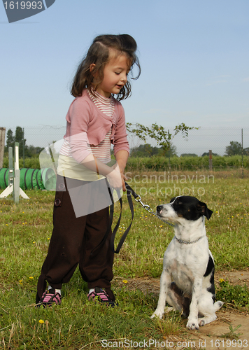 Image of little girl and dog