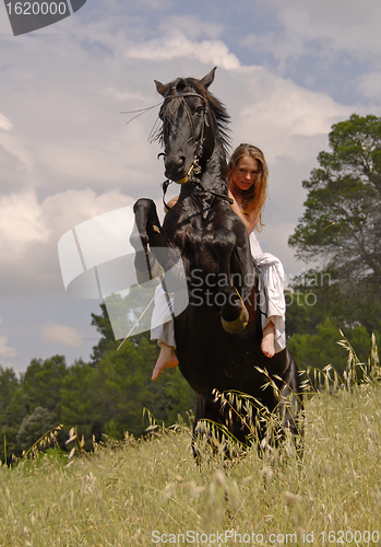 Image of rearing horse and teen