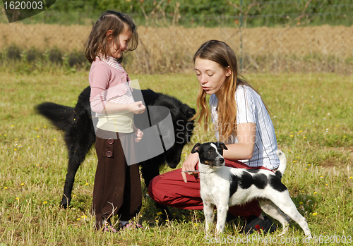 Image of sisters and dogs