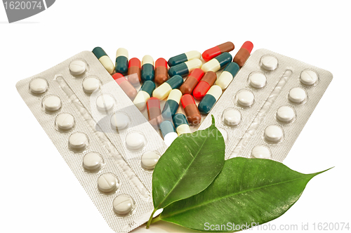 Image of Pills and Capsules medical Bio with green leaf