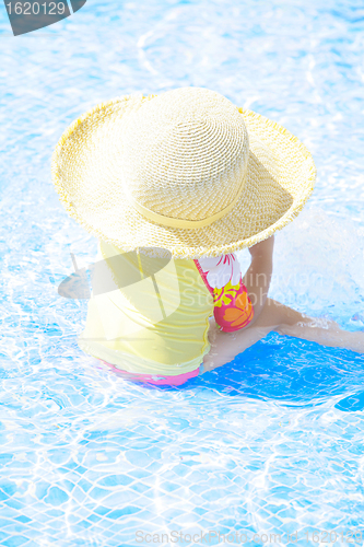 Image of fashion toddler girl playing in swimming pool 