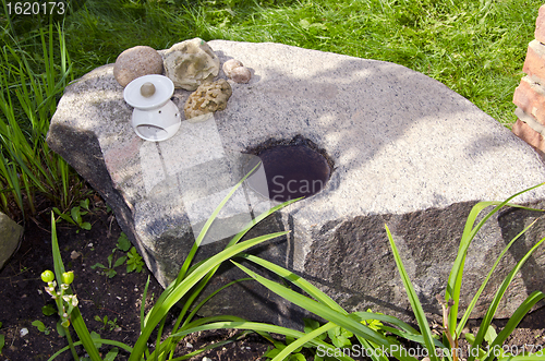 Image of Decorative ancient stone water in hole objects 
