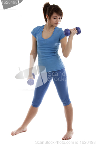 Image of Beautiful girl with dumbbells