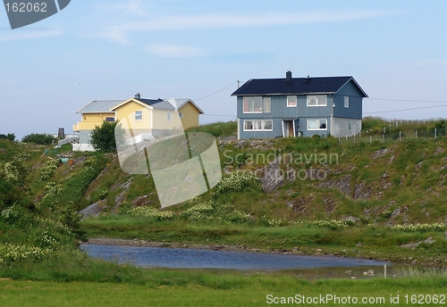 Image of Blue and yellow house.