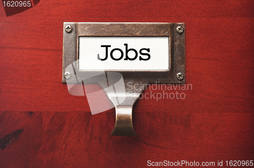 Image of Lustrous Wooden Cabinet with Jobs File Label