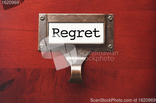 Image of Lustrous Wooden Cabinet with Regret File Label