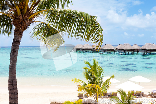 Image of overwater bungalows in the lagoon