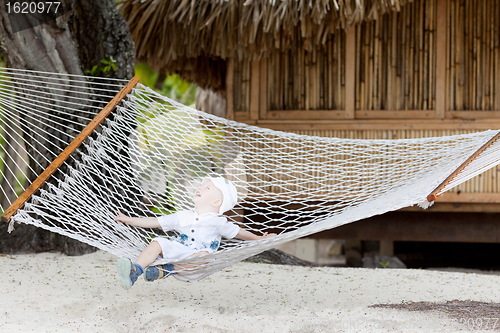 Image of adorable toddler in a hammock