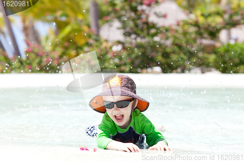 Image of adorable toddler by the pool