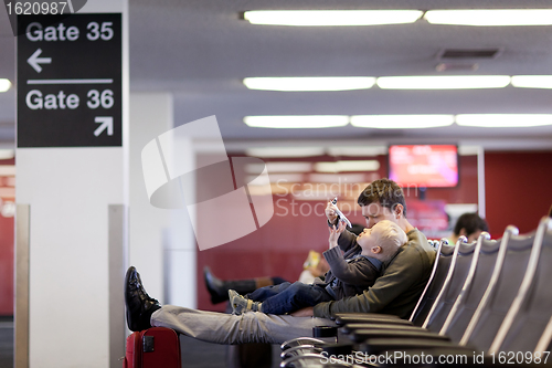 Image of father and son at the airport