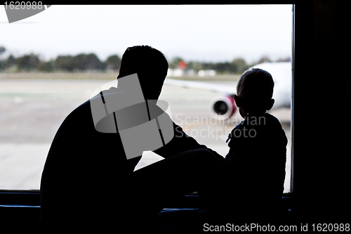 Image of father and son at the airport