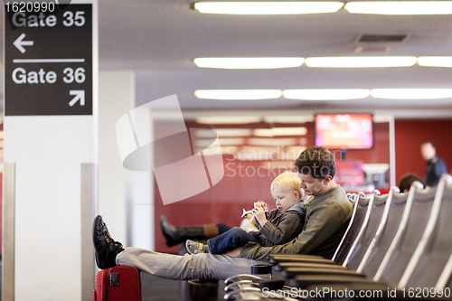 Image of father and son at the airport