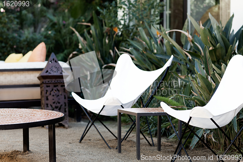 Image of white chairs in a lounge