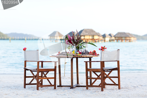 Image of romantic dinner at the beach