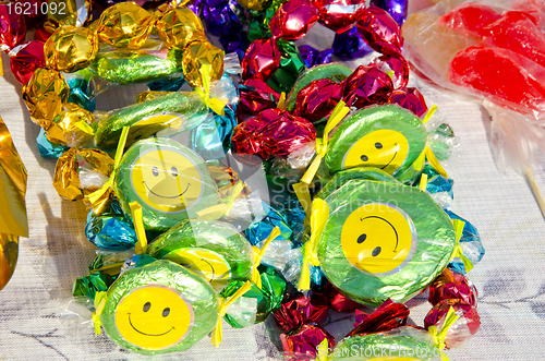Image of Colorful candies smiles sold street fair sunlight 