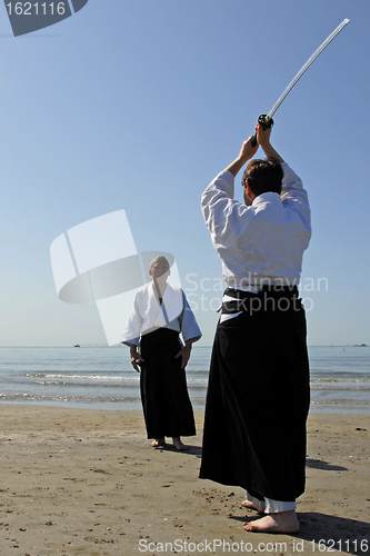 Image of training of Aikido on the beach