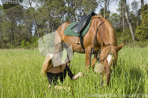 Image of blond girl and her stallion