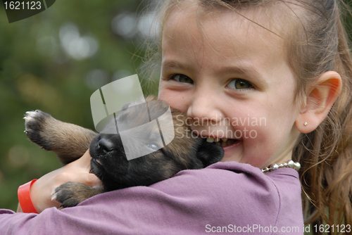 Image of little girl and puppy