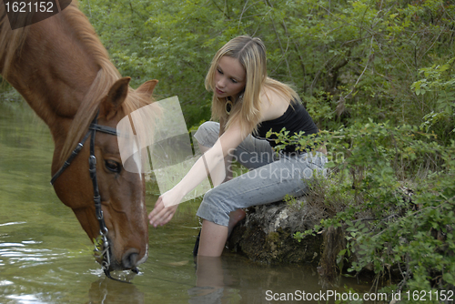 Image of riding girl in river