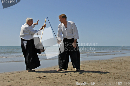 Image of training of Aikido on the beach