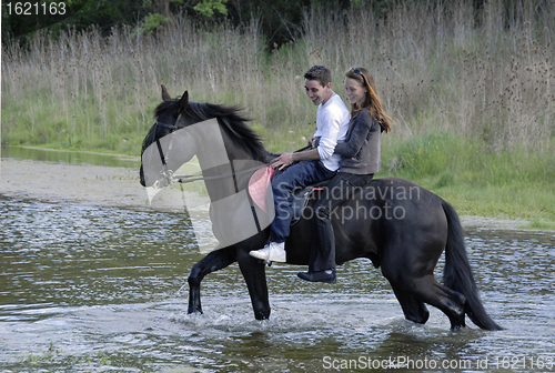 Image of riding lovers