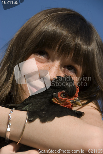 Image of child and chicken