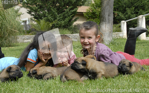 Image of children and puppies