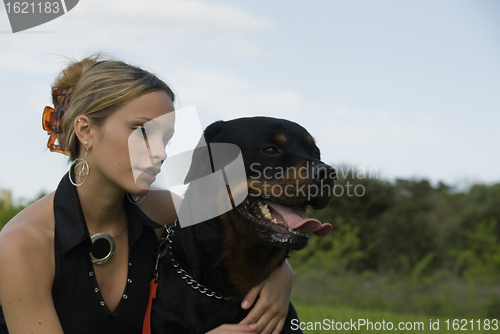 Image of teenager and rottweiler