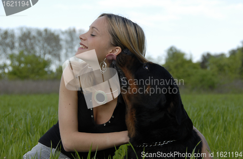 Image of happy young teenager and her dog