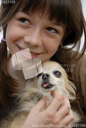 Image of child and chihuahua