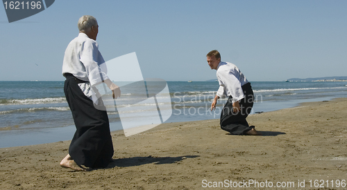 Image of training of Aikido on the beach