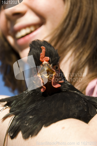 Image of child and her chicken