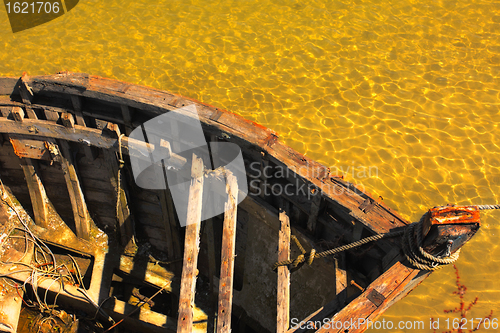 Image of carcass old wooden boat damaged by time