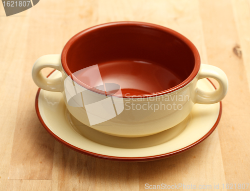 Image of Cup of soup on a plate