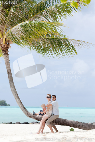 Image of happy family at the beach