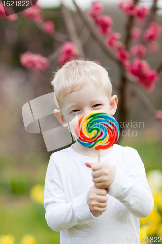 Image of toddler with lollipop